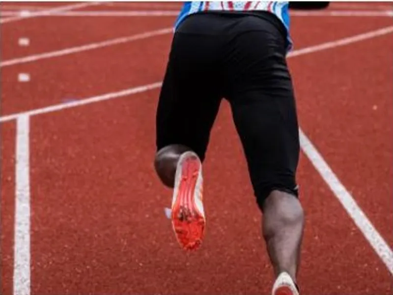 Sprinter leaving the starting blocks on a running track