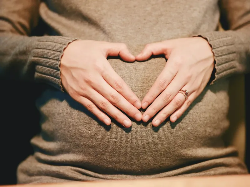 Pregnant woman performing pelvic mobility exercises