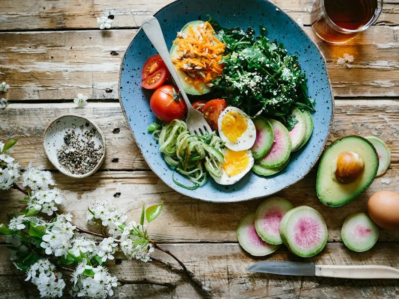 Salmon salad with wakame seaweed, egg, avocado and almonds